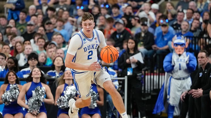 Mar 21, 2025; Raleigh, NC, USA; Duke Blue Devils forward Cooper Flagg (2) dribbles the ball against the Mount St. Mary's Mountaineers during the first half in the first round of the NCAA Tournament at Lenovo Center. Mandatory Credit: Bob Donnan-Imagn Images Mar 21, 2025; Raleigh, NC, USA; Duke Blue Devils forward Cooper Flagg (2) dribbles the ball against the Mount St. Mary's Mountaineers during the first half in the first round of the NCAA Tournament at Lenovo Center. Mandatory Credit: Bob Donnan-Imagn Images
