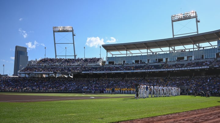 The LSU Tigers and the Florida Gators line up on the field before the game at Charles Schwab Field Omaha.
