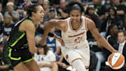 Heading into the WNBA Finals, Alyssa Thomas (right) sits 13 assists behind Courtney Vandersloot for playoff career assists. 