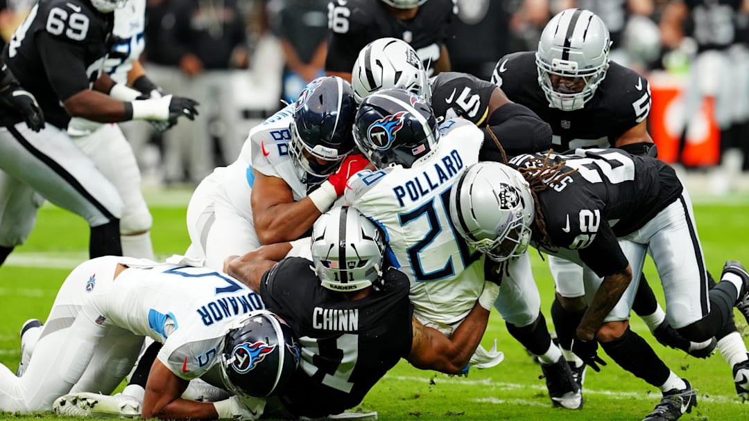 Oct 12, 2025; Paradise, Nevada, USA; Tennessee Titans running back Tony Pollard (20) is tackled during the first half against the Las Vegas Raiders at Allegiant Stadium. Mandatory Credit: Stephen R. Sylvanie-Imagn Images