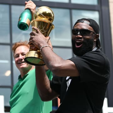 Jun 21, 2024; Boston, MA, USA; Boston Celtics guard Jaylen Brown (7) holds the MVP trophy during the 2024 NBA Championship parade in Boston. Mandatory Credit: Brian Fluharty-USA TODAY Sports