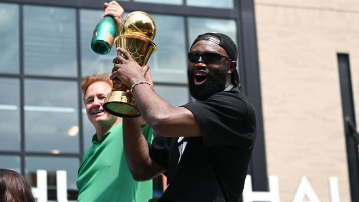 Jun 21, 2024; Boston, MA, USA; Boston Celtics guard Jaylen Brown (7) holds the MVP trophy during the 2024 NBA Championship parade in Boston. Mandatory Credit: Brian Fluharty-USA TODAY Sports