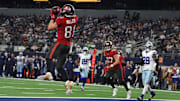 Dec 22, 2024; Arlington, Texas, USA; Tampa Bay Buccaneers wide receiver Ryan Miller (81) catches a touchdown pass against the Dallas Cowboys in the fourth quarter at AT&T Stadium. Mandatory Credit: Tim Heitman-Imagn Images