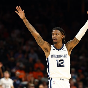 Oct 29, 2025; Phoenix, Arizona, USA; Memphis Grizzlies guard Ja Morant (12) reacts against the Phoenix Suns during the second half at the Mortgage Matchup Center. Mandatory Credit: Mark J. Rebilas-Imagn Images