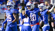 Nov 22, 2025; Dallas, Texas, USA; The SMU Mustangs defense celebrates an interception by safety Tyren Polley (10) against the Louisville Cardinals during the second half at Gerald J. Ford Stadium. Mandatory Credit: Jerome Miron-Imagn Images