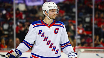 Nov 21, 2024; Calgary, Alberta, CAN; New York Rangers defenseman Jacob Trouba (8) against the Calgary Flames during the second period at Scotiabank Saddledome. Mandatory Credit: Sergei Belski-Imagn Images