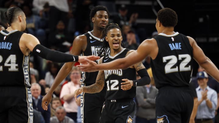 Memphis Grizzlies guard Ja Morant (12) huddles with forward Dillon Brooks (24), forward Jaren Jackson Jr. (13) and guard Desmond Bane (22) during the second half against the Los Angeles Lakers at FedExForum. Mandatory Credit: