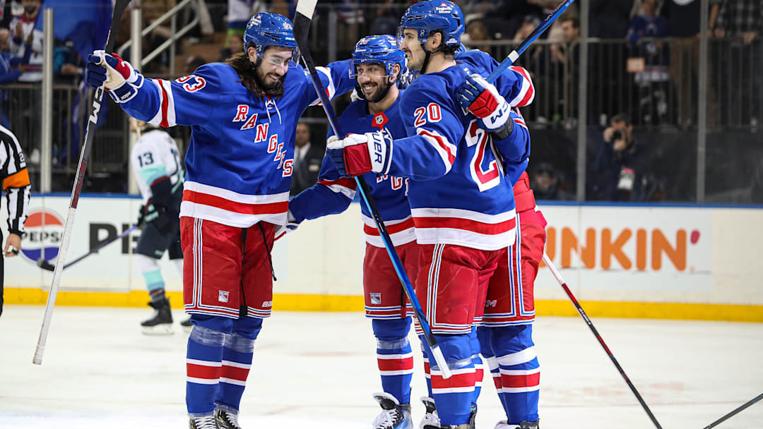 Dec 8, 2024; New York, New York, USA; New York Rangers center Vincent Trocheck (16) celebrates his power play goal with defenseman Adam Fox (23), left wing Chris Kreider (20) and left wing Artemi Panarin (10) during the second period against the Seattle Kraken at Madison Square Garden. Mandatory Credit: Danny Wild-Imagn Images