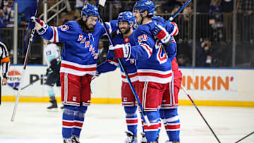 Dec 8, 2024; New York, New York, USA; New York Rangers center Vincent Trocheck (16) celebrates his power play goal with defenseman Adam Fox (23), left wing Chris Kreider (20) and left wing Artemi Panarin (10) during the second period against the Seattle Kraken at Madison Square Garden. Mandatory Credit: Danny Wild-Imagn Images