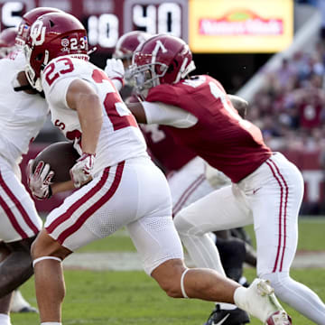 Nov 15, 2025; Tuscaloosa, Alabama, USA;  Oklahoma Sooners defensive back Eli Bowen (23) runs a interception back for a touchdown during the first half against the Alabama Crimson Tide at Saban Field at Bryant-Denny Stadium. Mandatory Credit: Gary Cosby-Imagn Images