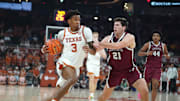 Texas Longhorns guard Dailyn Swain dribbles against Lafayette Leopards guard Andrew Phillips during the second quarter at Moody Center.