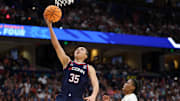 Apr 6, 2025; Tampa, FL, USA; Connecticut Huskies guard Azzi Fudd (35) shoots the ball South Carolina Gamecocks guard MiLaysia Fulwiley (12) during the first half of the national championship of the women's 2025 NCAA tournament at Amalie Arena. Mandatory Credit: Nathan Ray Seebeck-Imagn Images