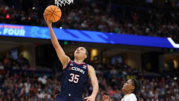 Apr 6, 2025; Tampa, FL, USA; Connecticut Huskies guard Azzi Fudd (35) shoots the ball South Carolina Gamecocks guard MiLaysia Fulwiley (12) during the first half of the national championship of the women's 2025 NCAA tournament at Amalie Arena. Mandatory Credit: Nathan Ray Seebeck-Imagn Images