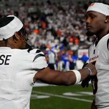 Cincinnati Bengals wide receiver Ja'Marr Chase (1) and wide receiver Tee Higgins (5) talk on the sideline in the fourth quarter of the NFL Week 3 game between the Cincinnati Bengals and the Los Angeles Rams at Paycor Stadium in downtown Cincinnati on Monday, Sept. 25, 2023. The Bengals beat the Rams, 19-16, improving to 1-2.