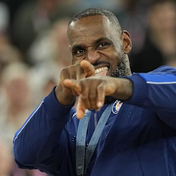 Aug 10, 2024; Paris, France; United States guard LeBron James (6) celebrates with the gold medal after the game against France in the men's basketball gold medal game during the Paris 2024 Olympic Summer Games at Accor Arena. Mandatory Credit: Kyle Terada-Imagn Images