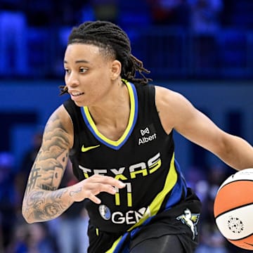 Jun 28, 2025; Arlington, Texas, USA; Dallas Wings guard JJ Quinerly (11) brings the ball up court against the Washington Mystics during the second half at College Park Center. Mandatory Credit: Jerome Miron-Imagn Images