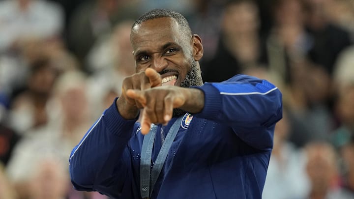 Aug 10, 2024; Paris, France; United States guard LeBron James (6) celebrates with the gold medal after the game against France in the men's basketball gold medal game during the Paris 2024 Olympic Summer Games at Accor Arena. Mandatory Credit: Kyle Terada-Imagn Images