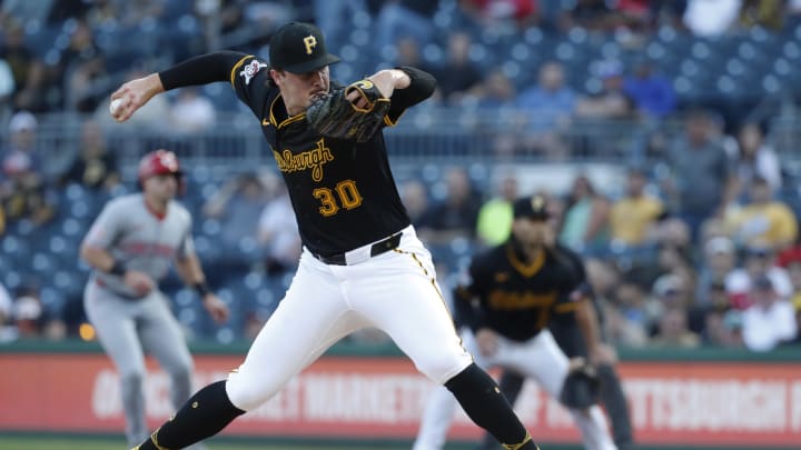 Aug 22, 2024; Pittsburgh, Pennsylvania, USA;  Pittsburgh Pirates starting pitcher Paul Skenes (30) delivers a pitch against the Cincinnati Reds during the first inning at PNC Park. Mandatory Credit: Charles LeClaire-USA TODAY Sports