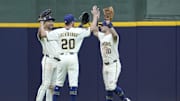 Milwaukee, Wisconsin, USA; Milwaukee Brewers outfielder Blake Perkins (16), outfielder Brandon Lockridge (20) and outfielder Sal Frelick (10) celebrate a 12-5 win over the Pittsburgh Pirates at American Family Field.