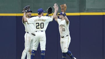 Milwaukee, Wisconsin, USA; Milwaukee Brewers outfielder Blake Perkins (16), outfielder Brandon Lockridge (20) and outfielder Sal Frelick (10) celebrate a 12-5 win over the Pittsburgh Pirates at American Family Field.