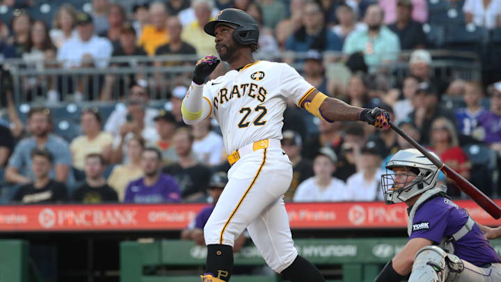 Aug 23, 2025; Pittsburgh, Pennsylvania, USA;  Pittsburgh Pirates designated hitter Andrew McCutchen (22) hits a two run home run against the Colorado Rockies during the second inning at PNC Park. Mandatory Credit: Charles LeClaire-Imagn Images