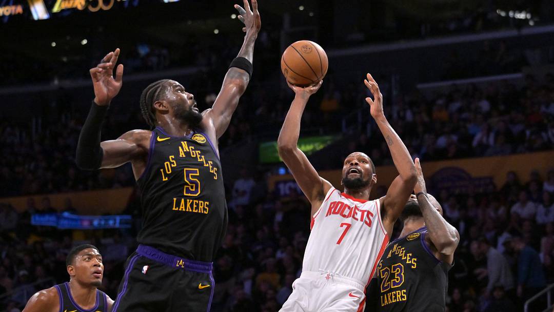 Apr 21, 2026; Los Angeles, California, USA; Houston Rockets forward Kevin Durant (7) is defended by Los Angeles Lakers center Deandre Ayton (5) as he drives to the basket during the second half of game two of the first round of the 2026 NBA Playoffs at Crypto.com Arena. Mandatory Credit: Jayne Kamin-Oncea-Imagn Images