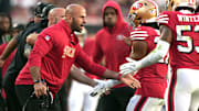 Oct 19, 2025; Santa Clara, California, USA; San Francisco 49ers defensive coordinator Robert Saleh (left) congratulates linebacker Dee Winters (right) during the second quarter against the Atlanta Falcons at Levi's Stadium. Mandatory Credit: Darren Yamashita-Imagn Images