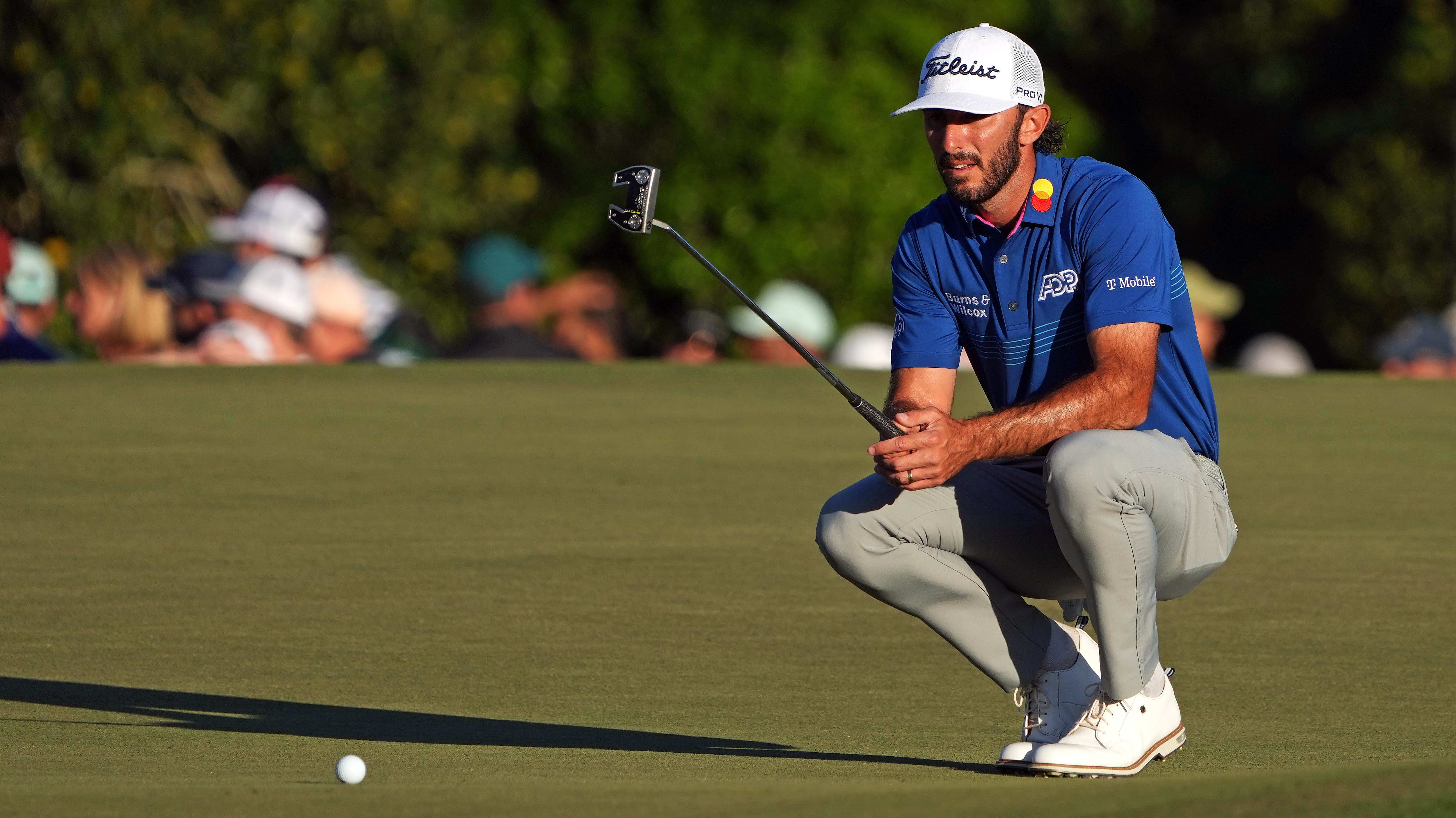 Max Homa lines up a putt at Augusta National
