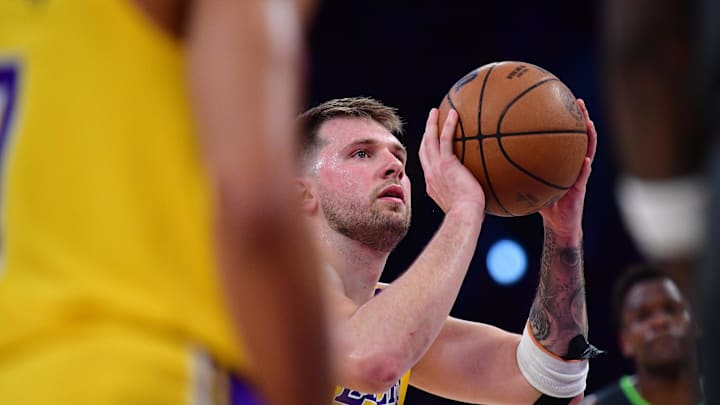 Apr 30, 2025; Los Angeles, California, USA; Los Angeles Lakers guard Luka Doncic (77) shoots a free throw against the Minnesota Timberwolves during the first half in game five of first round for the 2025 NBA Playoffs at Crypto.com Arena. Mandatory Credit: Gary A. Vasquez-Imagn Images Apr 30, 2025; Los Angeles, California, USA; Los Angeles Lakers guard Luka Doncic (77) shoots a free throw against the Minnesota Timberwolves during the first half in game five of first round for the 2025 NBA Playoffs at Crypto.com Arena. Mandatory Credit: Gary A. Vasquez-Imagn Images
