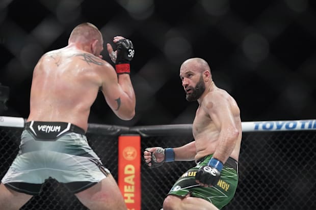 Dustin Jacoby (red gloves) fights Azamat Murzakanov (blue gloves) during UFC Fight Night at T-Mobile Center. 