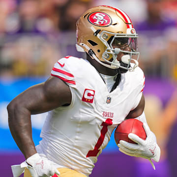 Sep 15, 2024; Minneapolis, Minnesota, USA; San Francisco 49ers wide receiver Deebo Samuel Sr. (1) runs back a kick against the Minnesota Vikings in the first quarter at U.S. Bank Stadium. Mandatory Credit: Brad Rempel-Imagn Images