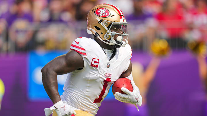 Sep 15, 2024; Minneapolis, Minnesota, USA; San Francisco 49ers wide receiver Deebo Samuel Sr. (1) runs back a kick against the Minnesota Vikings in the first quarter at U.S. Bank Stadium. Mandatory Credit: Brad Rempel-Imagn Images