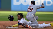 Oct 2, 2025; Cleveland, Ohio, USA; Cleveland Guardians third baseman Jose Ramirez (11) is tagged out at second by Detroit Tigers outfielder Javier Baez (28) in the eighth inning during game three of the Wildcard round for the 2025 MLB playoffs at Progressive Field. Mandatory Credit: Ken Blaze-Imagn Images