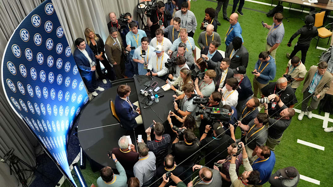 July 15, 2025; Atlanta, GA, USA; Texas quarterback Arch Manning is surrounded by media as he participates in SEC Media Days at the College Football Hall of Fame in Atlanta.