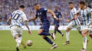 Dec 18, 2022; Lusail, Qatar; France forward Kylian Mbappe (10) dribbles the ball against Argentina forward Lionel Messi (10) during the second half of the 2022 World Cup final at Lusail Stadium. Mandatory Credit: Yukihito Taguchi-Imagn Images