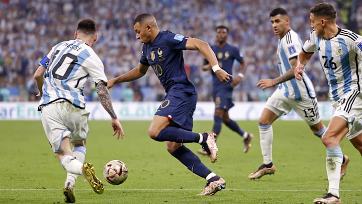 Dec 18, 2022; Lusail, Qatar; France forward Kylian Mbappe (10) dribbles the ball against Argentina forward Lionel Messi (10) during the second half of the 2022 World Cup final at Lusail Stadium. Mandatory Credit: Yukihito Taguchi-Imagn Images Dec 18, 2022; Lusail, Qatar; France forward Kylian Mbappe (10) dribbles the ball against Argentina forward Lionel Messi (10) during the second half of the 2022 World Cup final at Lusail Stadium. Mandatory Credit: Yukihito Taguchi-Imagn Images