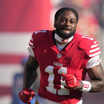 Sep 9, 2024; Santa Clara, California, USA; San Francisco 49ers wide receiver Brandon Aiyuk (11) is introduced to the crowd before the game against the New York Jets at Levi's Stadium. Mandatory Credit: Darren Yamashita-Imagn Images