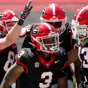 Georgia running back Andrew Paul (3) celebrates with his teammates after scoring a touchdown during the G-Day spring football game in Athens, Ga., on Saturday, April 13, 2024.