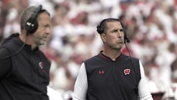 Sep 20, 2025; Madison, Wisconsin, USA; Wisconsin Badgers head coach Luke Fickell, right, looks on during the second quarter of their game against Maryland Terrapins at Camp Randall Stadium. Mandatory Credit: Mark Hoffman/USA Today Network via Imagn Images