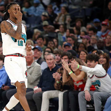 Dec 26, 2024; Memphis, Tennessee, USA; Memphis Grizzlies guard Ja Morant (12) reacts after a three point basket during the second quarter against the Toronto Raptors at FedExForum. Mandatory Credit: Petre Thomas-Imagn Images