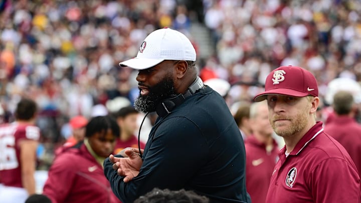 Sep 16, 2023; Chestnut Hill, Massachusetts, USA; Florida State Seminoles offensive coordinator Alex Atkins speaks to the team during the second half against the Boston College Eagles at Alumni Stadium. Mandatory Credit: Eric Canha-Imagn Images
