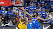 Jun 8, 2025; Oklahoma City, Oklahoma, USA; Indiana Pacers guard Andrew Nembhard (2) and Oklahoma City Thunder forward Kenrich Williams (34) battle for the rebound during the second quarter of game two of the 2025 NBA Finals at Paycom Center. Mandatory Credit: Kyle Terada-Imagn Images