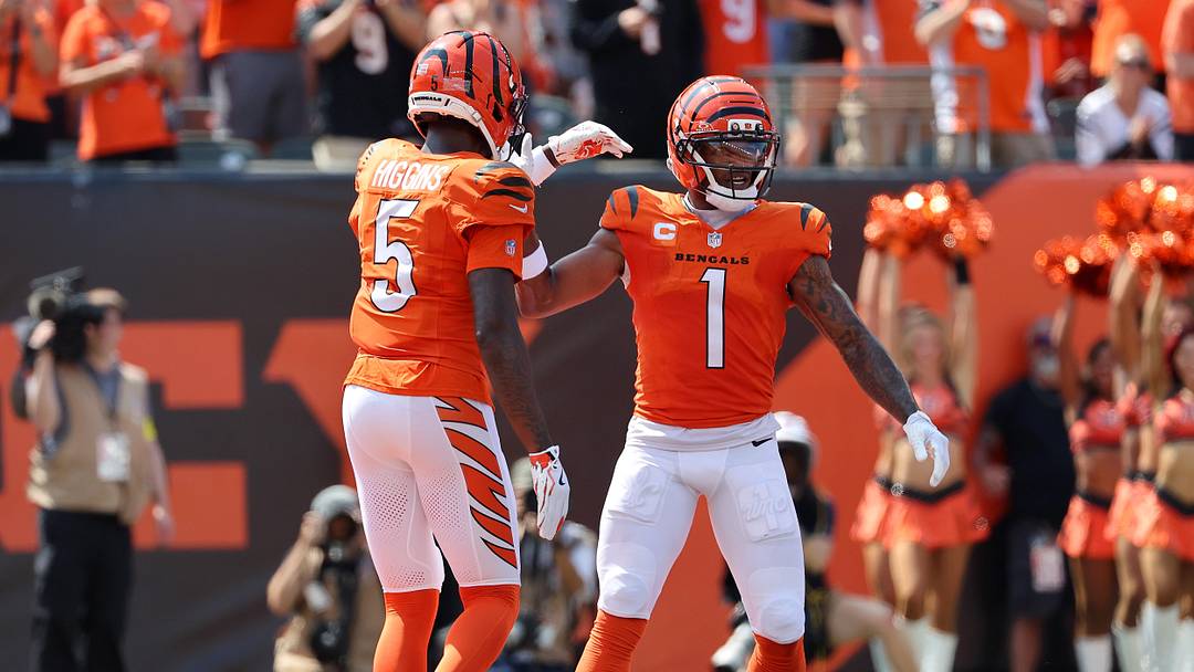 Sep 14, 2025; Cincinnati, Ohio, USA; Cincinnati Bengals wide receiver Ja'Marr Chase (1) celebrates his touchdown  with wide receiver Tee Higgins (5) during the first quarter against the Jacksonville Jaguars at Paycor Stadium. Mandatory Credit: Joseph Maiorana-Imagn Images