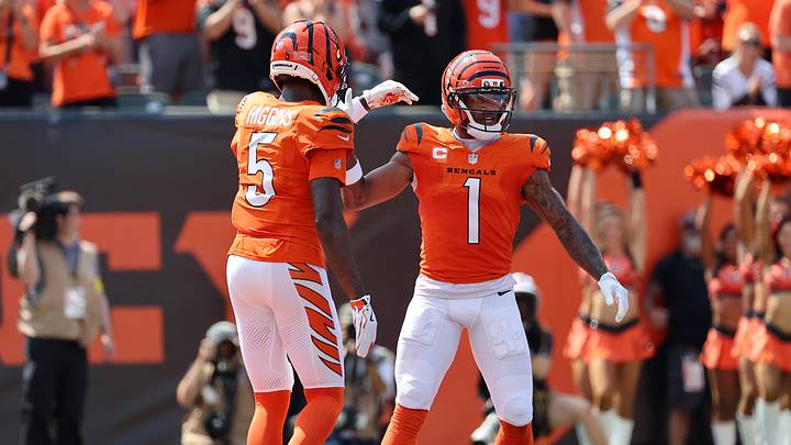 Sep 14, 2025; Cincinnati, Ohio, USA; Cincinnati Bengals wide receiver Ja'Marr Chase (1) celebrates his touchdown  with wide receiver Tee Higgins (5) during the first quarter against the Jacksonville Jaguars at Paycor Stadium. Mandatory Credit: Joseph Maiorana-Imagn Images