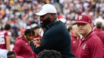 Sep 16, 2023; Chestnut Hill, Massachusetts, USA; Florida State Seminoles offensive coordinator Alex Atkins speaks to the team during the second half against the Boston College Eagles at Alumni Stadium. Mandatory Credit: Eric Canha-Imagn Images