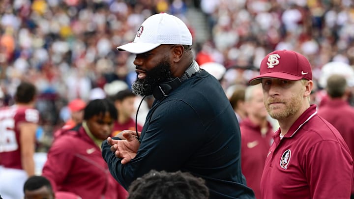 Sep 16, 2023; Chestnut Hill, Massachusetts, USA; Florida State Seminoles offensive coordinator Alex Atkins speaks to the team during the second half against the Boston College Eagles at Alumni Stadium. Mandatory Credit: Eric Canha-Imagn Images