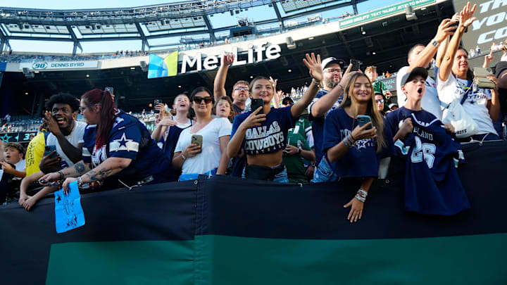 Dallas Cowboys fans at MetLife Stadium, scream for their favorite players as they exit the field after the game.