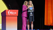 Hailey Van Lith poses with WNBA commissioner Cathy Engelbert after being selected by the Chicago Sky in the 2025 WNBA Draft.