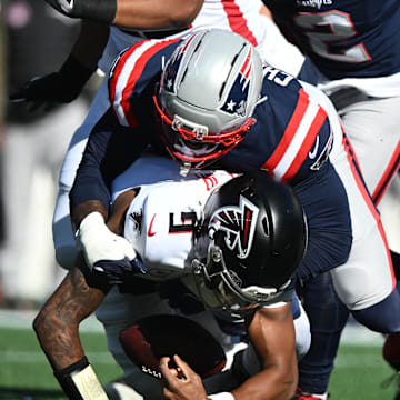 Nov 2, 2025; Foxborough, Massachusetts, USA; New England Patriots linebacker K'Lavon Chaisson (44) sacks Atlanta Falcons quarterback Michael Penix Jr. (9) during the first quarter at Gillette Stadium. Mandatory Credit: Brian Fluharty-Imagn Images