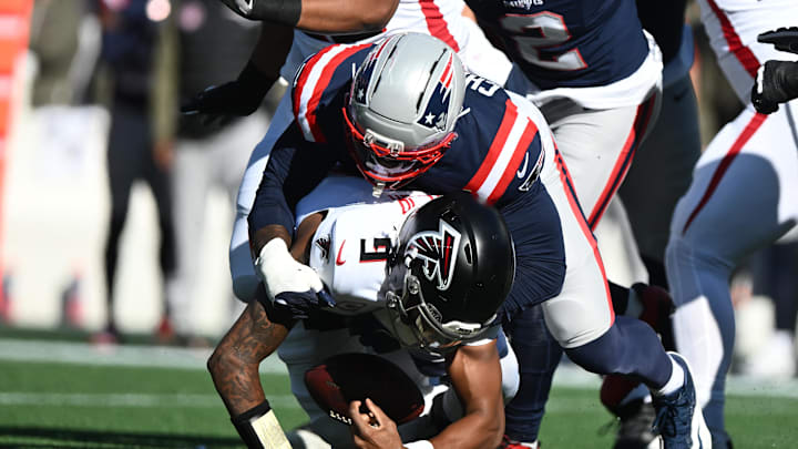 Nov 2, 2025; Foxborough, Massachusetts, USA; New England Patriots linebacker K'Lavon Chaisson (44) sacks Atlanta Falcons quarterback Michael Penix Jr. (9) during the first quarter at Gillette Stadium. Mandatory Credit: Brian Fluharty-Imagn Images